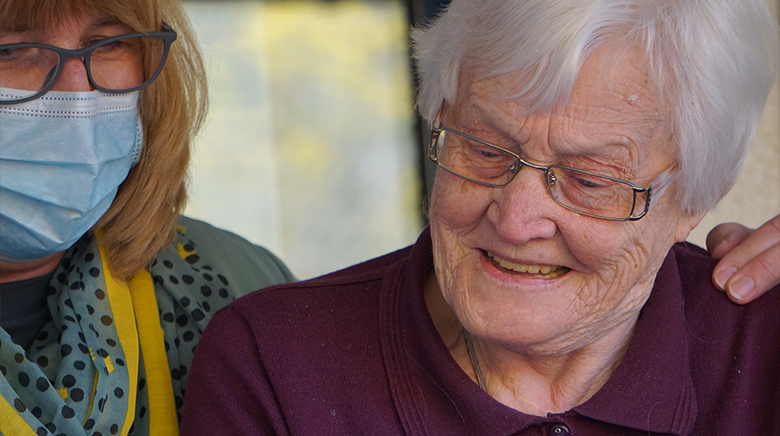 two ladies smiling