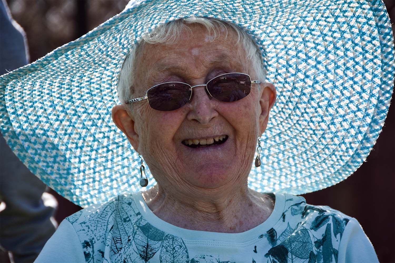 older lady wearing a sunhat