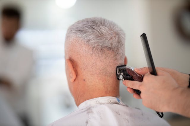 older man having hi haircut